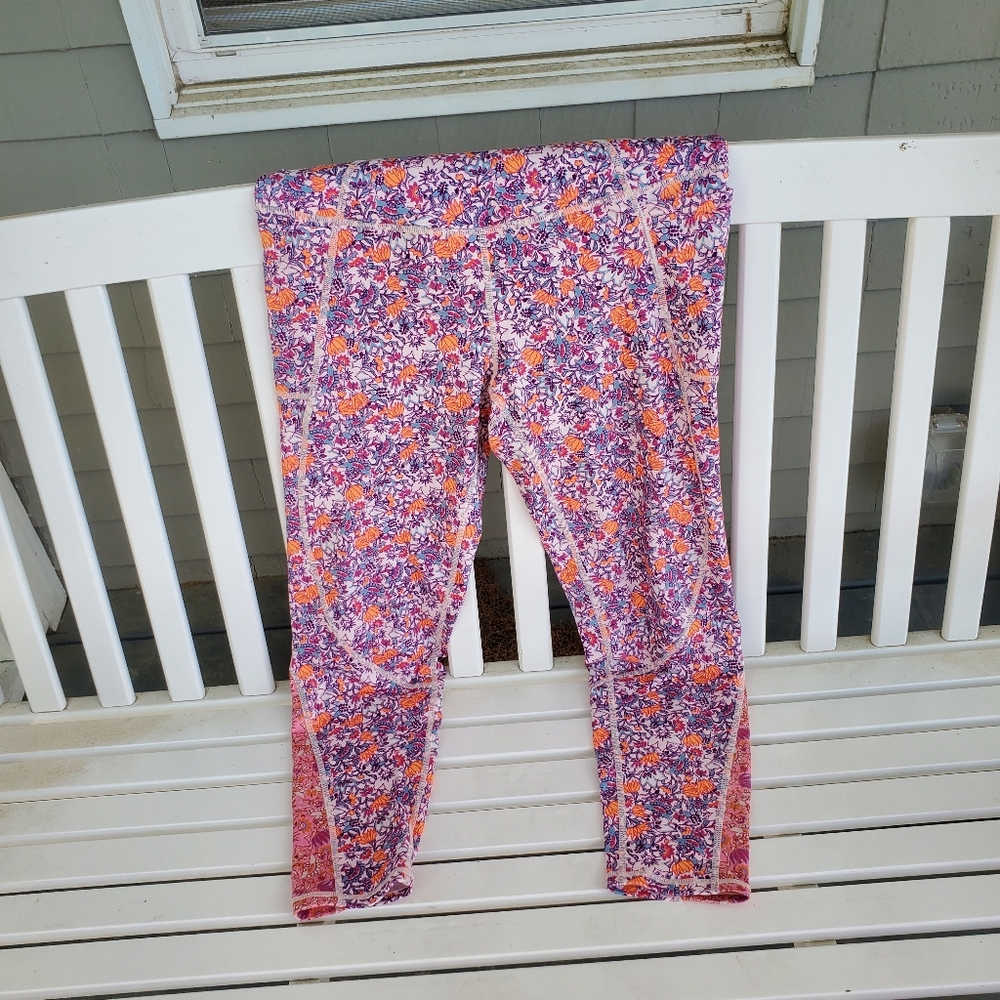 FREE PEOPLE MOVEMENT LEGGINGS WITH LOGO'S NEVER WORN OR WASHED size large. Logos
